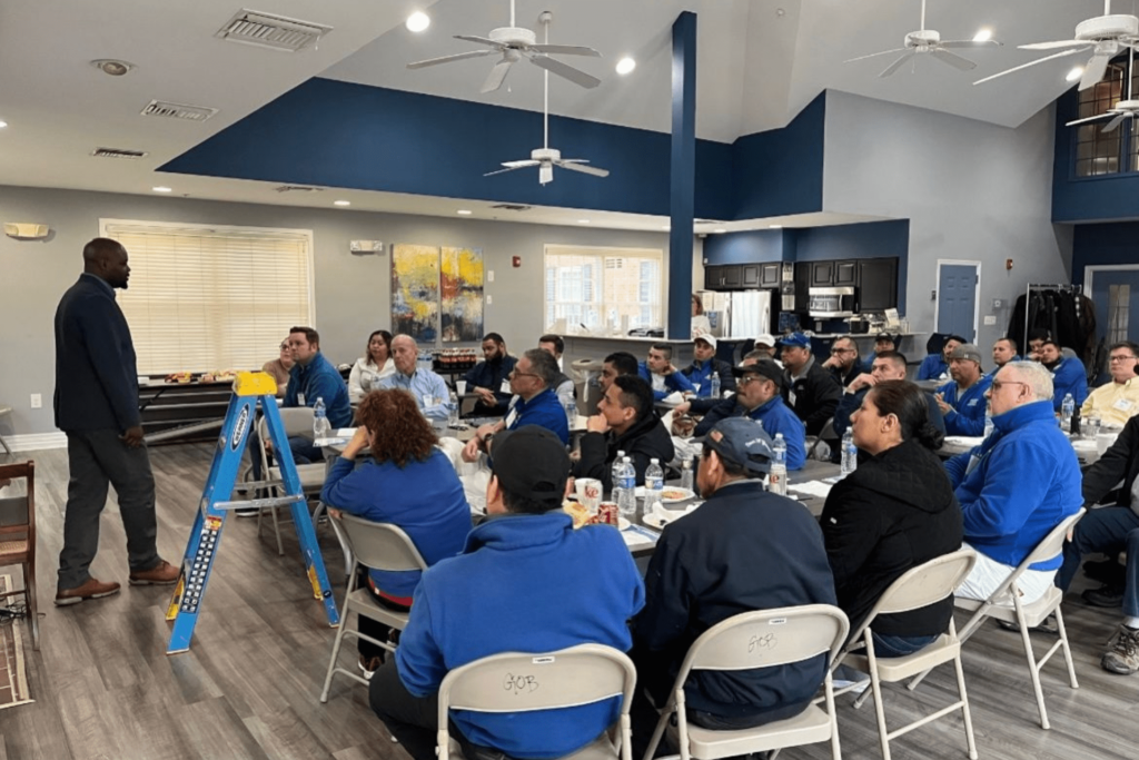 A man leading a training & development class for HBW Construction's team. 